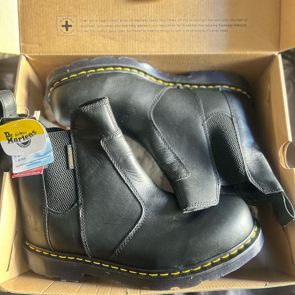 Brand new still in the box never been worn Black Boots with Yellow Stitching